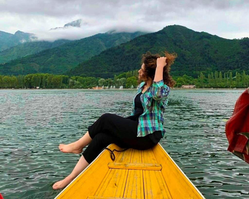 Dal Lake, Kashmir, tourist paradise of Srinagar with clear water, Shikara float, Pir Panjal Mountains