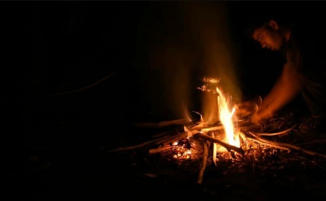 Boy Lighting Up Bonfire | Camping Near Mumbai-Hikerwolf