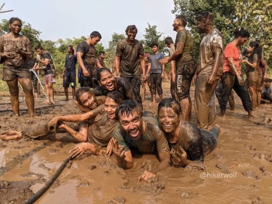 Friends Posing During Mudbath |Camping Near PuneHikerwolf